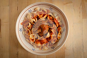 Authentic Italian meal orecchiette and braciola with tomato sauce