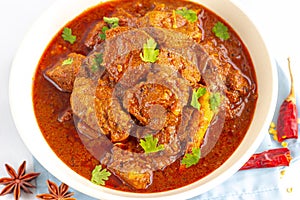 Authentic Lamb Vindaloo Traditional Fiery Red Indian / Goan Curry of Lamb. photo