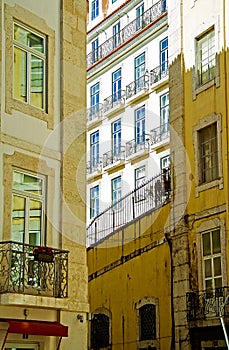 Authentic Lisbon street. The road with the rails along the street goes up for the turn. Lisbon