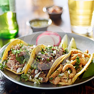 Authentic mexican street tacos on plate with beef and pork