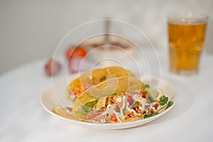 Authentic mexican tacos with beer. Mexican tacos with ground meat, beef, beans, onions and salsa