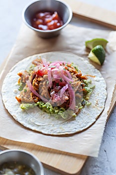 Authentic mexican tacos with pork meat and vegetables