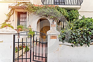 Authentic old house with wooden door and window and garden