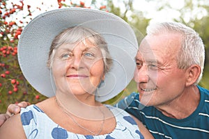 Authentic outdoor shot of aging couple having fun in the garden and blessed with love