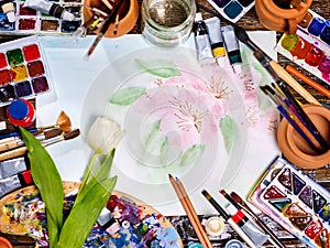 Authentic paint brushes still life on table in art class school.