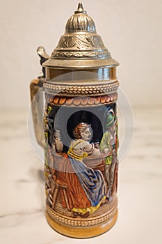 An authentic painted german beer mug on a marble plate