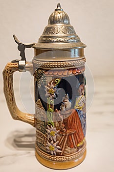 An authentic painted german beer mug on a marble plate