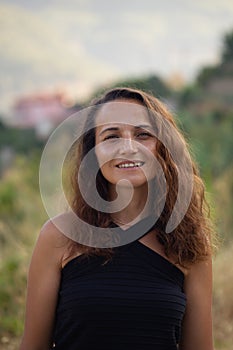 Authentic portrait of smiling brunette female