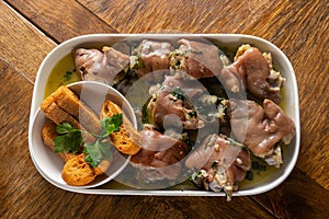 Authentic Portuguese Alentejo Pig Trotters with Coriander Sauce. photo