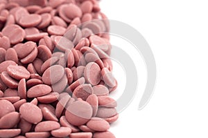 Authentic Ruby Chocolate Drops on a White Background
