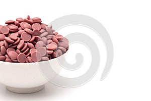 Authentic Ruby Chocolate Drops on a White Background