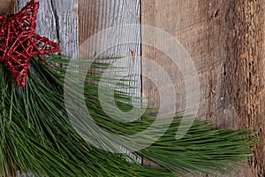 Authentic and rustic Christmas holiday decorations on weathered wood