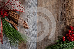 Authentic and rustic Christmas holiday decorations on weathered wood