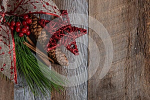Authentic and rustic Christmas holiday decorations on weathered wood
