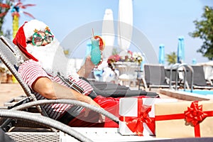 Authentic Santa Claus with cocktail resting