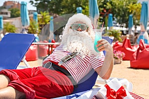 Authentic Santa Claus with cocktail resting