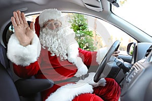 Authentic Santa Claus driving car