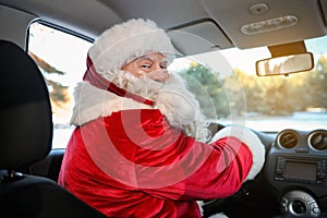 Authentic Santa Claus driving car