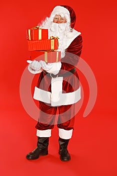 Authentic Santa Claus with gift boxes