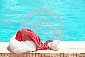 Authentic Santa Claus hat near pool