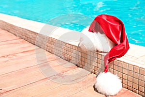 Authentic Santa Claus hat near pool