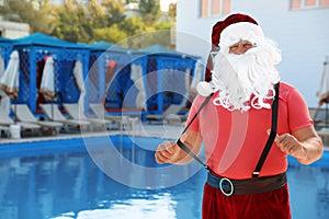 Authentic Santa Claus near pool