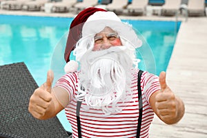 Authentic Santa Claus near swimming pool