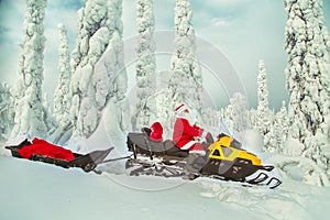 Authentic Santa Claus is riding a snowmobile through the winter