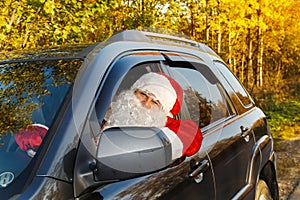 Authentic Santa Claus. Santa Claus drives a car.