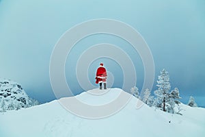 Authentic Santa Claus on a snowy mountain