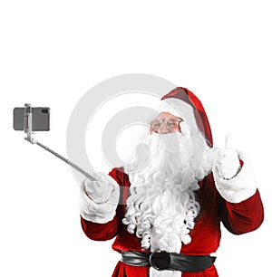 Authentic Santa Claus taking selfie on background