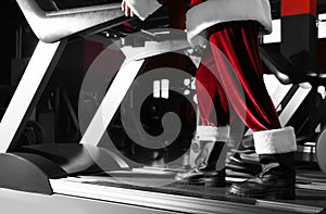 Authentic Santa Claus training on treadmill in gym, closeup