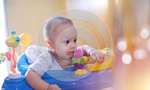 Authentic shot of Cute Asian toddler baby boy while playing toy with smile face.