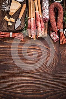 Authentic spanish tapa on wooden bar table.