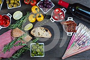 Authentic spanish tapas selection on wooden table from above