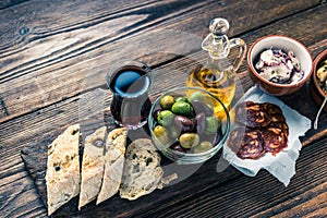 Authentic spanish tapas on wooden board, tonned picture