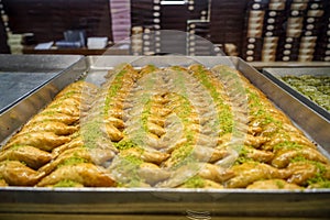 Authentic sweet Baklava, traditional turkish famous delicious dessert in tray showcase of local shop in Istanbul