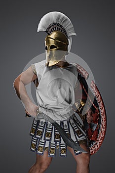 Authentic swordsman from greece isolated on gray background