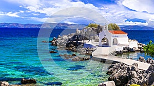 Turquoise sea and traditional white church in Chios island,Greece. photo