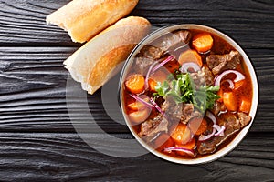 Authentic Vietnamese Beef Stew Bo Kho closeup in bowl. Horizontal top view