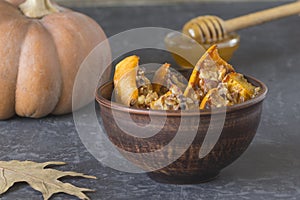 Authentic view of the baked sliced pumpkin with honey and walnut