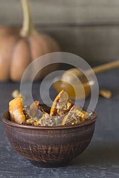 Authentic view of the baked sliced pumpkin with honey and walnut