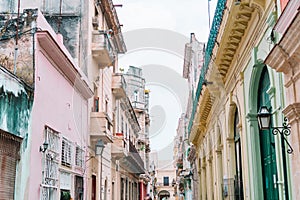 Authentic view of a street of Old Havana with old buildings and cars