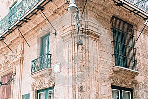 Authentic view of a street of Old Havana with old buildings and cars