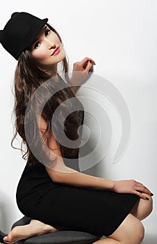 Authentic Woman in Black Dress and Woolen Cap