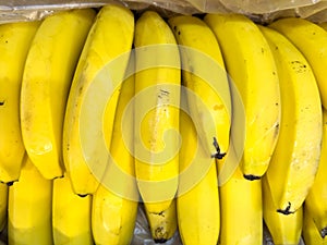 Authentic yellow bananas for sale. Close-up. Selective focus