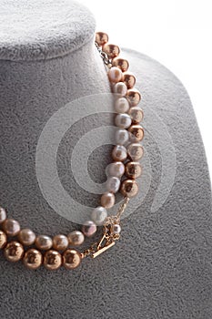 Author beautiful  pearls necklaces demonstrated on maneken. fashion and jewelry concept