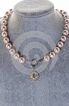 author beautiful pearls necklaces demonstrated on maneken. fashion and jewelry concept photo