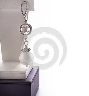 author jewelry erring with white pearl demonstrated against white background. fashion and jewelry concept