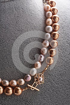 Author  pearls necklace demonstrated on maneken. close up. fashion and jewelry concept